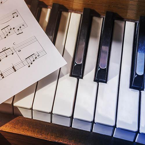 Piano with sheet music image