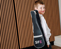 Student with SFE branding ukulele case