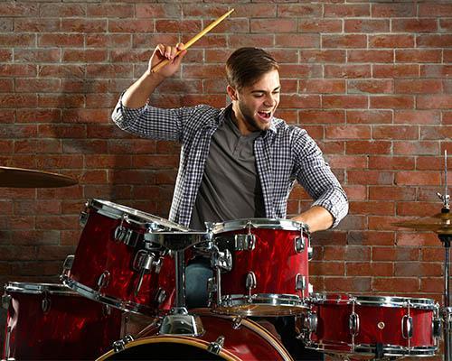 playing-a-beginners-drum-kit