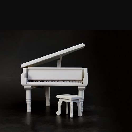 white piano and bench on black background