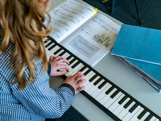 student playing a foldable keyboard piano